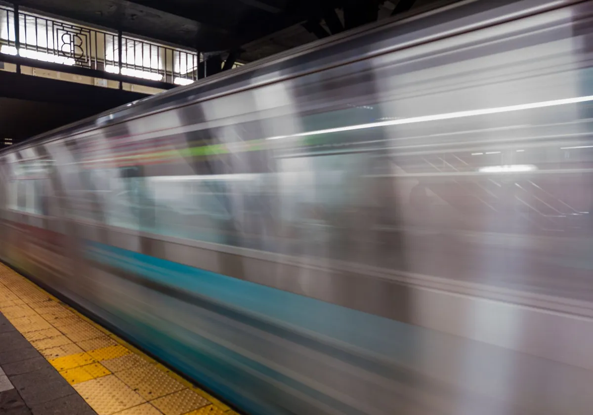 Dynamic capture of a fast-moving subway train in NYC, showcasing urban transit motion.